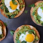 Avocado Breakfast Tostadas - Crispy, oven-baked tortillas topped with fresh guacamole and fried eggs