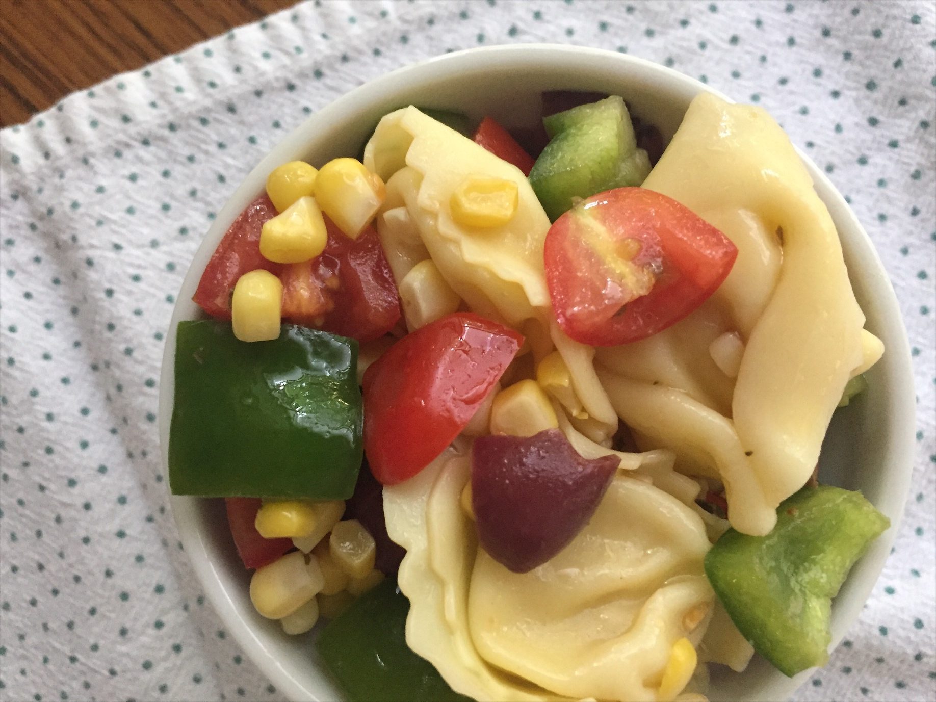 This easy and healthy vegetarian tortellini salad is loaded with vegetables like fresh summer corn, bell pepper, tomatoes, and more!